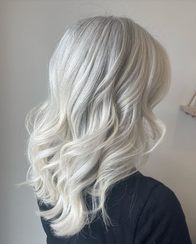 Icy blonde waves styled at Neau Salon